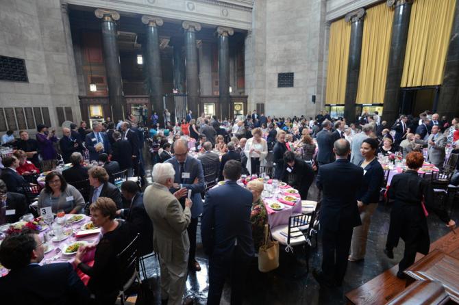 Luncheon guests take their seats.