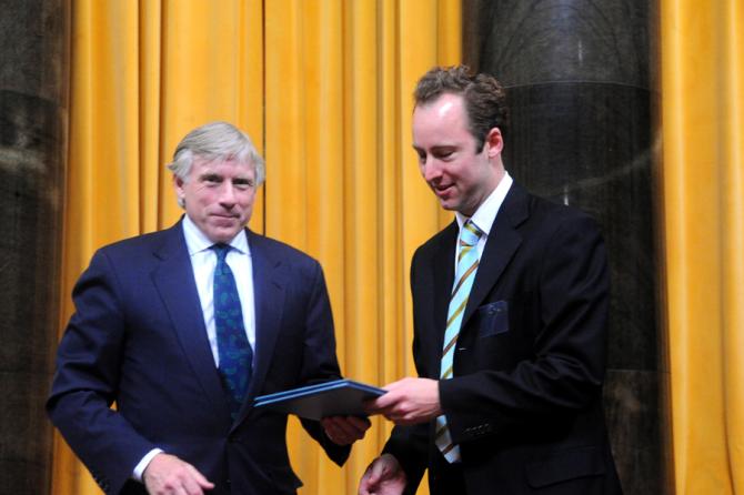 Lee C. Bollinger (left) presents the 2011 Pulitzer Prize in Criticism to Sebastian Smee of The Boston Globe.
