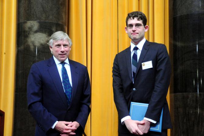 Lee C. Bollinger (left) presents the 2011 Pulitzer Prize in Editorial Writing to Joseph Rago of The Wall Street Journal.