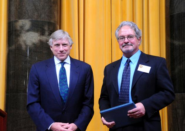 Lee C. Bollinger (left) presents the 2011 Pulitzer Prize in Editorial Cartooning to Mike Keefe of The Denver Post.