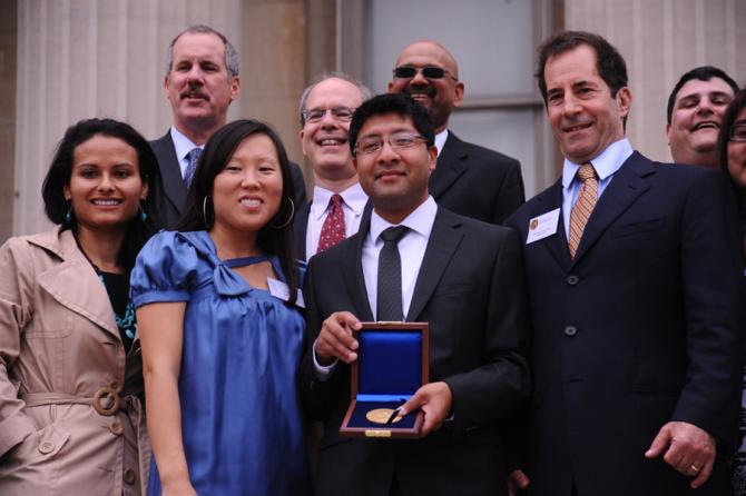 Members of the Los Angeles Times staff holding the Gold Medal for Public Service.