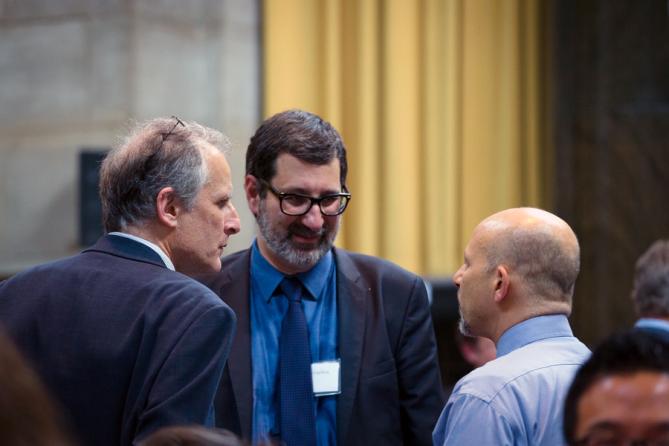 Pulitzer Board member Stephen Engelberg of ProPublica (center) talks with David Sassoon of InsideClimate News (left) and David Stone of Columbia University.