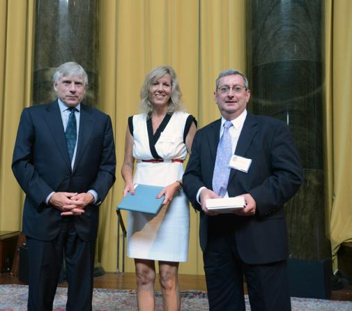 Lee C. Bollinger (left) presents the 2013 Pulitzer Prize in Public Service to Sally Kestin and John Maines of the Sun Sentinel, Fort Lauderdale, Fla.