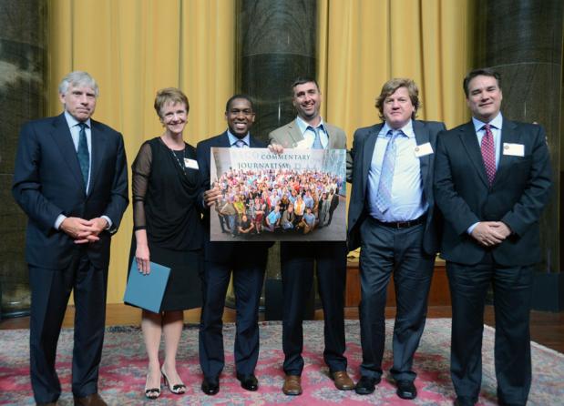 Lee C. Bollinger (left) presents the 2013 Pulitzer Prize in Breaking News Reporting to (left to right) Lee Ann Colacioppo, Kurtis Lee, RJ Sangosti, Tim Rasmussen and Kevin Dale of The Denver Post. Mr. Lee and Mr. Sangosti are holding a photograph of Denver Post staff members who also contributed to the prizewinning work.