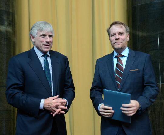 Lee C. Bollinger (left) presents the 2013 Pulitzer Prize in Criticism to Philip Kennicott of The Washington Post.
