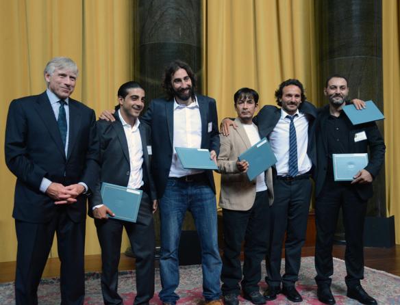 Lee C. Bollinger (left) presents the 2013 Pulitzer Prize in Breaking News Photography to (left to right) Muhammed Muheisen, Manu Brabo, Narciso Contreras, Rodrigo Abd and Khalil Hamra of the Associated Press.