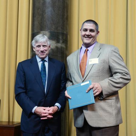 Lee C. Bollinger (left) presents the 2013 Pulitzer Prize in Fiction to Adam Johnson.