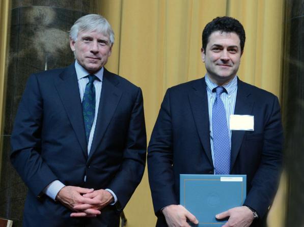 Lee C. Bollinger (left) presents the 2013 Pulitzer Prize in Biography to Tom Reiss.
