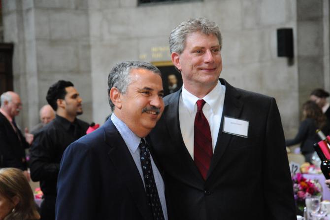 Thomas Friedman, co-chair of the Pulitzer Prize Board and columnist, The New York Times (left) and Michael James, executive editor of The Tuscaloosa News.