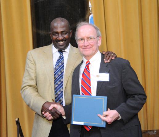 Gregory Moore (left) presents the 2012 Pulitzer Prize in Biography to John Lewis Gaddis.